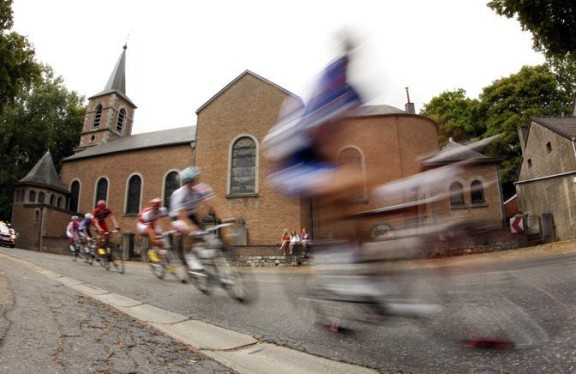A pack of riders cycles during the second stage of the Tour de France cycling race from Brussels to Spa
